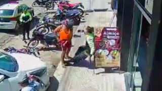 Parking warden is knocked out and left unconscious after attempting to stop a biker from leaving