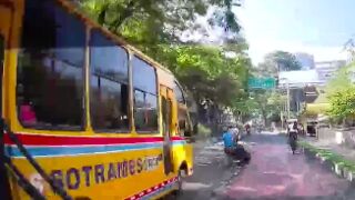 Man ends up underneath a bus after scooter accident in Colombia