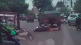 Woman riding a scooter with a child is crushed by military truck in Thailand, Child survives