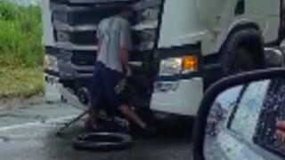 Biker left embedded in the front of a truck after a fatal collision, Brazil