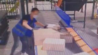 Conveyor belt drags in worker, China