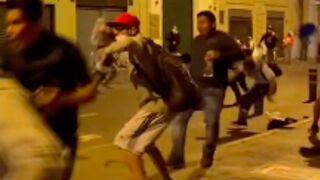 Protester gets shot in face and his hat blown off with tear gas canister in Peru