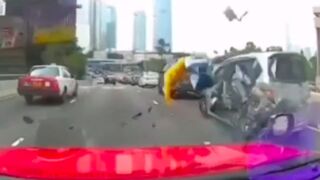 Yikes! man crashes his motorcycle into the back of a van then gets run over in China