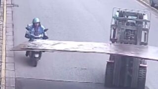 Moped rider gets clotheslined after a collision with a steel sheet in China