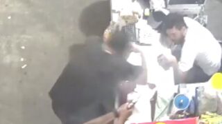 Store clerk shot in the face at close range by Hitman, Brazil