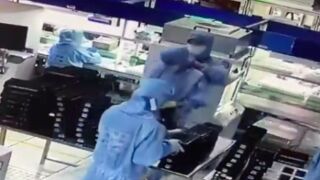 Man sneaks up behind his coworker and strangles him with a cord, China