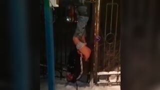 Drunk russian gets stripped naked tied up and left inverted on a Gate