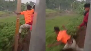 Teen hangs off the side of a train and hits a post in Bangladesh