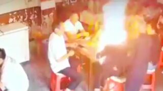 Man casually douses another with a flammable substance and sets him on fire in China