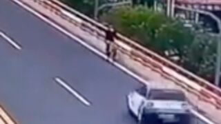 Cyclist gets hit and launched off a bridge in China