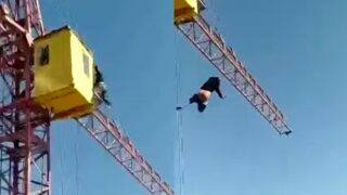 Migrant worker falls to his death after climbing a crane trying to flee immigration police in Russia