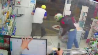 Two robbers dropped after they tried to rob a store in Brazil