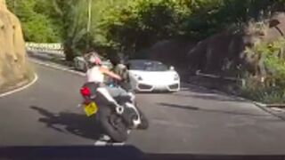 Female motorcyclist has a head on collision with a Lamborghini in Hong Kong