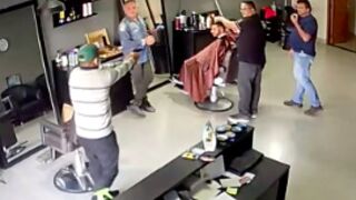 Customer caught slipping at a barber shop in Brazil