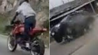 Biker obliterated after crashing and sliding underneath a car, explodes on impact