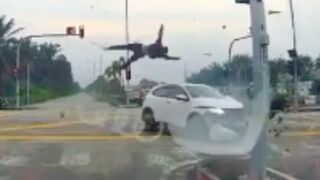 Bike performs a double cartwheel after getting hit at an intersection
