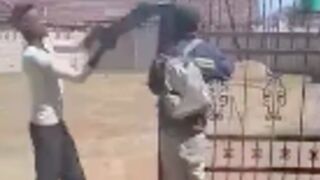 Thief gets tied to a gate and clapped around the head with an iron rod in Durban, South Africa