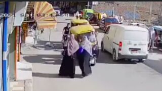 Woman gets knocked out by Rickshaw in India