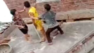 Old woman falls off a roof and dies after trying to split up a fight