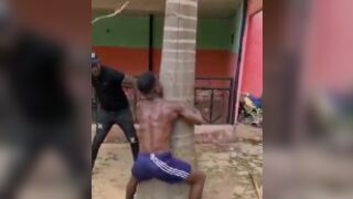 Man gets tied to a tree and beaten for stealing in Africa