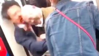 Two men get into a punch up on the subway