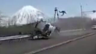 Crazy car accident in Russia driver flung out and sent 30ft into the air at high speeds (Wear a Seatbelt!)