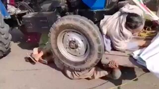 Protesters get run over by a tractor in India