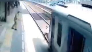 Man almost hit by a Train in Inida