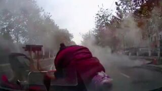 Elderly woman gets hit off her mobility scooter in China