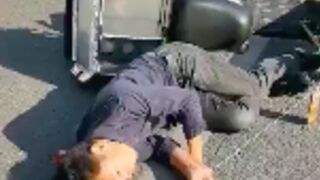 Man shaking after falling off his scooter without a helmet