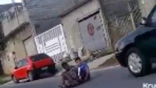 Two youths get into a collision with a car while going down a hill in a Go Kart