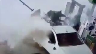 Tire explosion sends the man out the back the truck