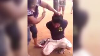 Guy gets tied to a post and beaten for an alleged rape in India