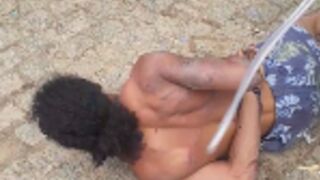 Guy whipped after he got caught stealing from traffickers in the Favela, Brazil