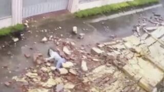 Wall Tumbles Crushing Vietnamese Woman After a Heavy Storm