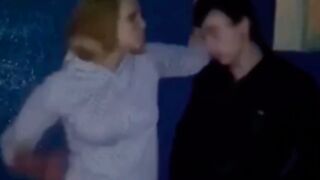 Guy gets punched up in a stairwell by a woman in Russia