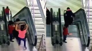 Little girl pushing brother in stroller fall down escalator in Russia