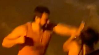 Abusive man gives his partner several punches to the face during an argument