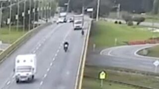 Box truck knocks cyclist off overpass