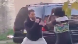 Man squares up with his baby mother and knocks her to the ground
