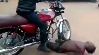 Man run over several times and beaten by vigilante biker gang in Africa