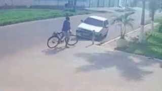 Cyclist gets sent into the air after a head on collision with a car