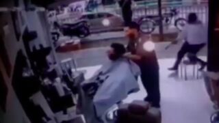 Man gets run up on while getting his haircut and shot in the head, Brazil