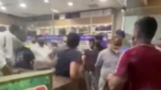 Disrespectful customer gets beat up and bottled by staff after running his mouth up inside a convenience store
