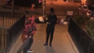 Guy hits a girl over the head with a skateboard because she rejected him