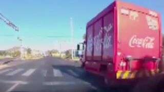 Motorcycle rider gets wiped out by a coca cola truck