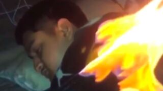 Guy gets set on fire by his friend while he was sleeping! ????
