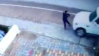 Man gets sent down the street after getting hit by a car!