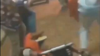 Guy gets taken out his wheel chair by an upper cut and stomped out!