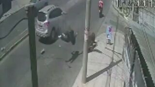 Man gets hit off his bike and collides with a street pole!